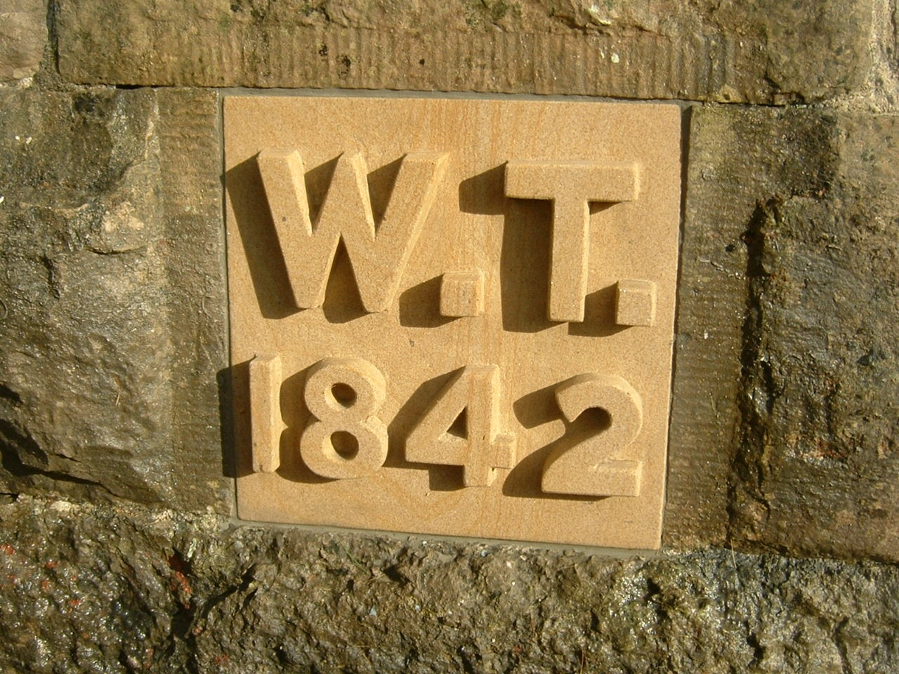 Background removed and letters left proud Name Plate Mounted within the wall.